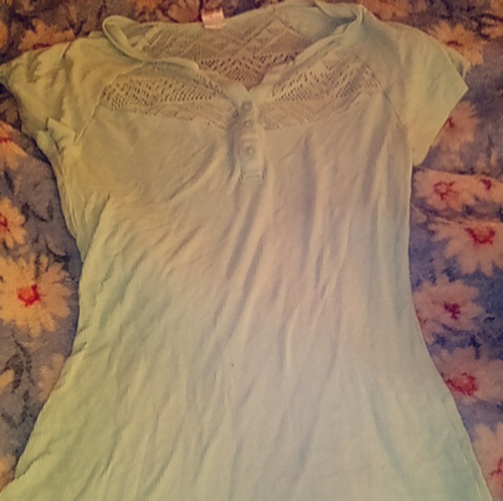 Light blue or teal shirt